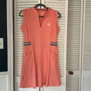 Cute tennis/golf dress with shorts that have pockets! Excellent condition size M